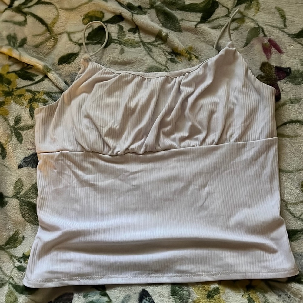 White crop top. Damaged on the left side but could be fixed with a bow? 🎀